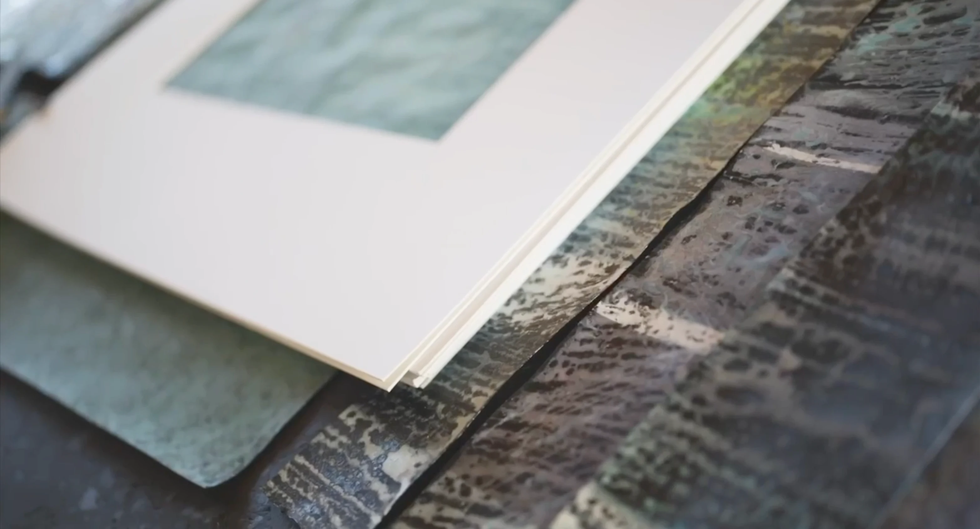 An open book on a weathered wooden table.